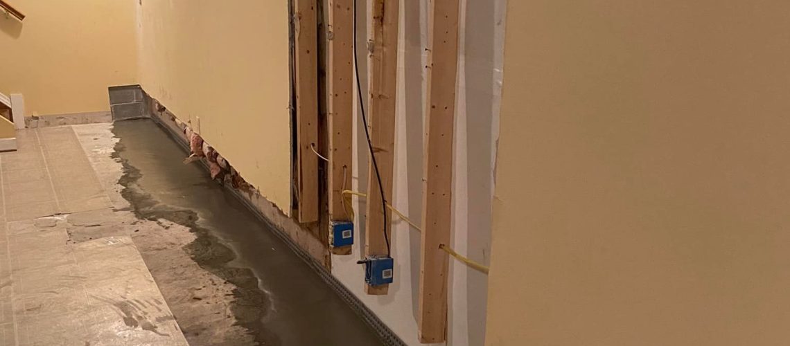 Basement in the process of being waterproofed | Lifespan of basement waterproofing | Once and Done Waterproofing WV, MD, PA, NJ