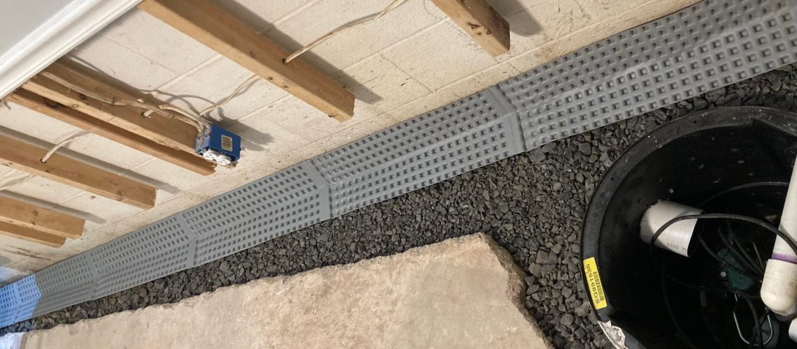 Sump Pump installation in progress | Once and Done Waterproofing