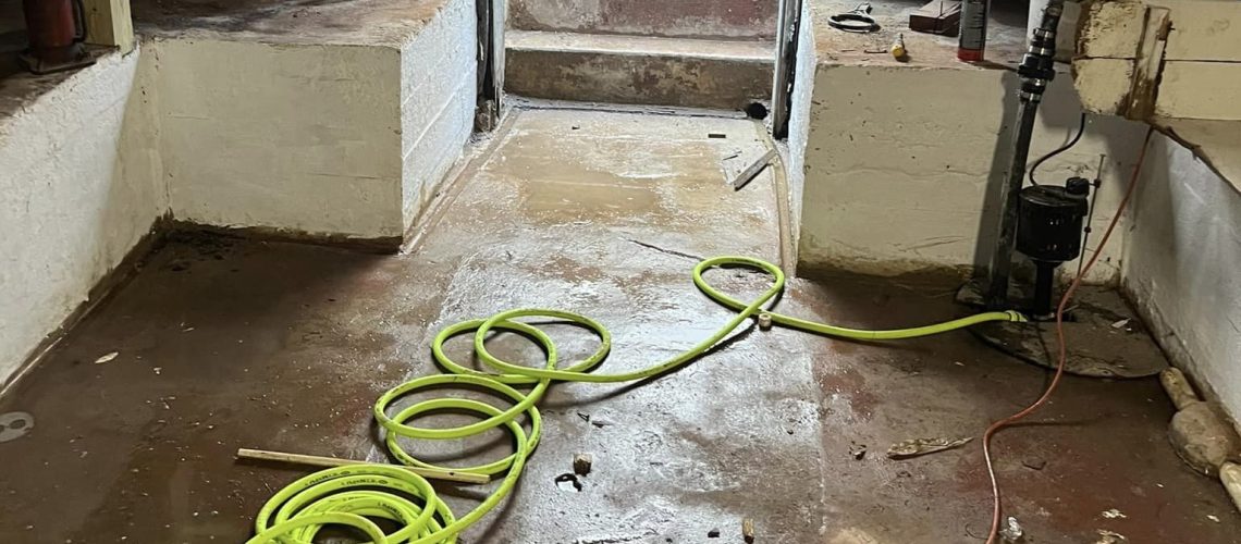 Flooded basement in the process of getting dried out | Basement Waterproofing | Once and Done Waterproofing